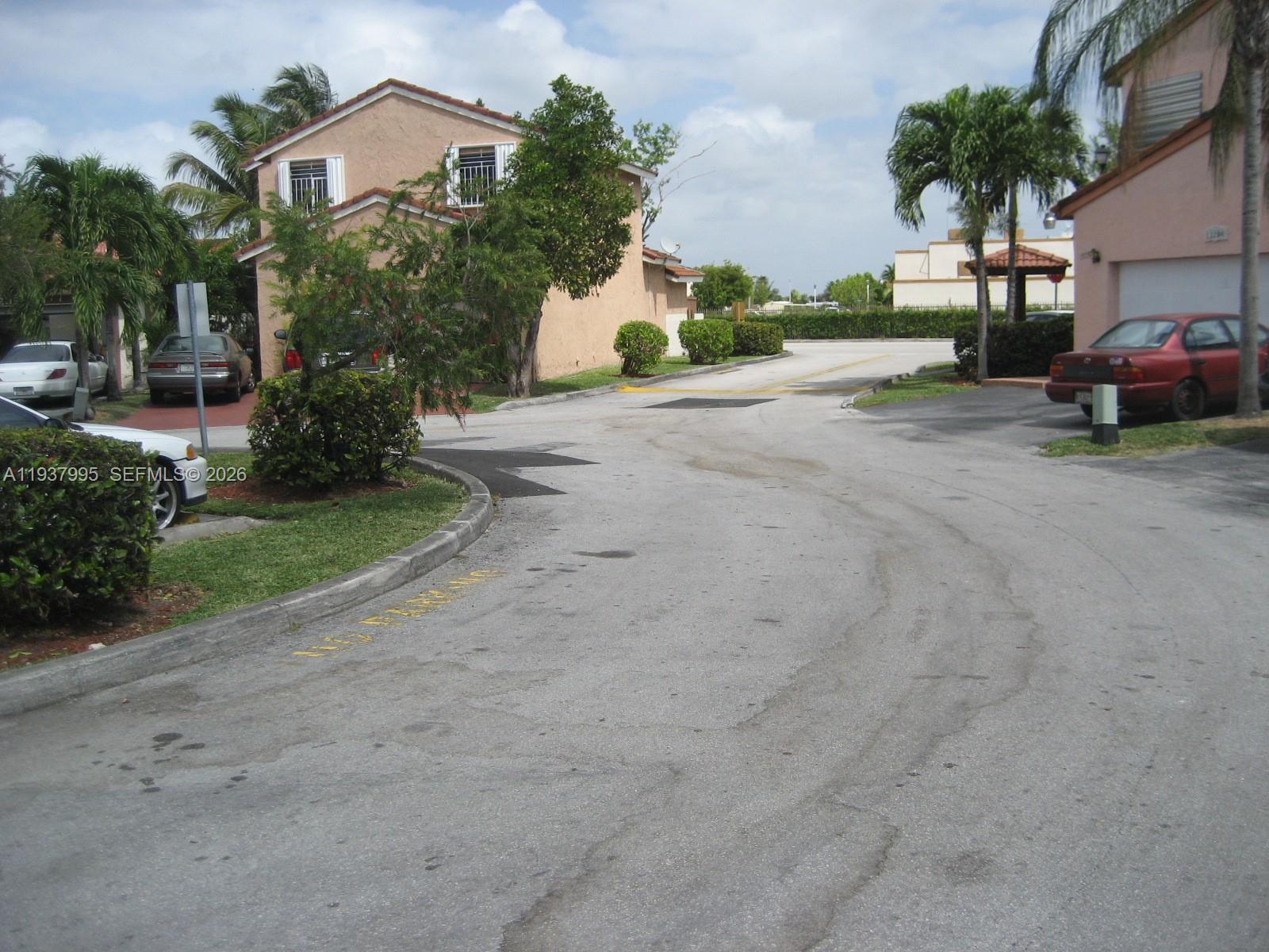 13224 Southwest 10th Terrace Miami, FL 33184 - Photo 30 of 32 a view of a street with cars parked