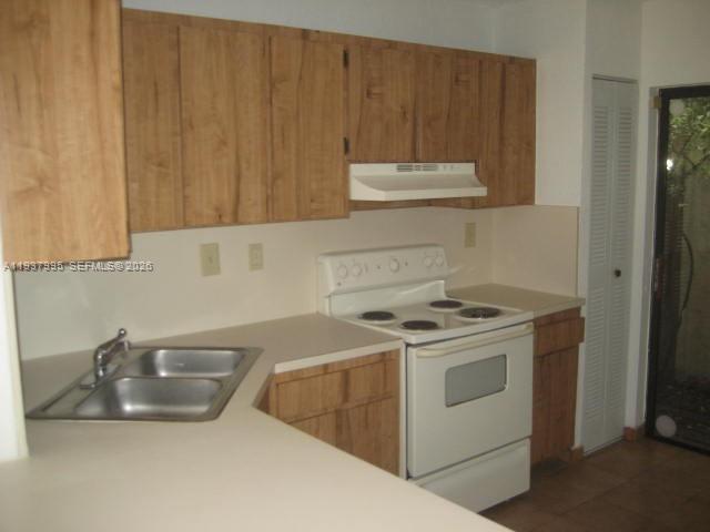 13224 Southwest 10th Terrace Miami, FL 33184 - Photo 5 of 32 a kitchen with a stove and a sink