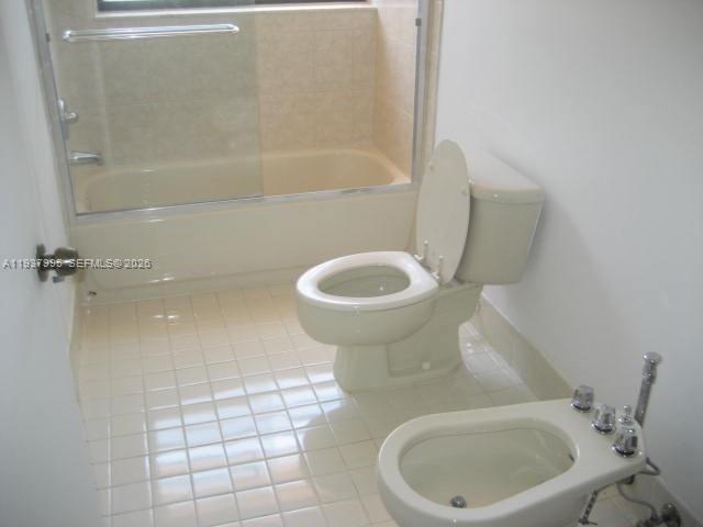 13224 Southwest 10th Terrace Miami, FL 33184 - Photo 7 of 32 a bathroom with a toilet and a shower