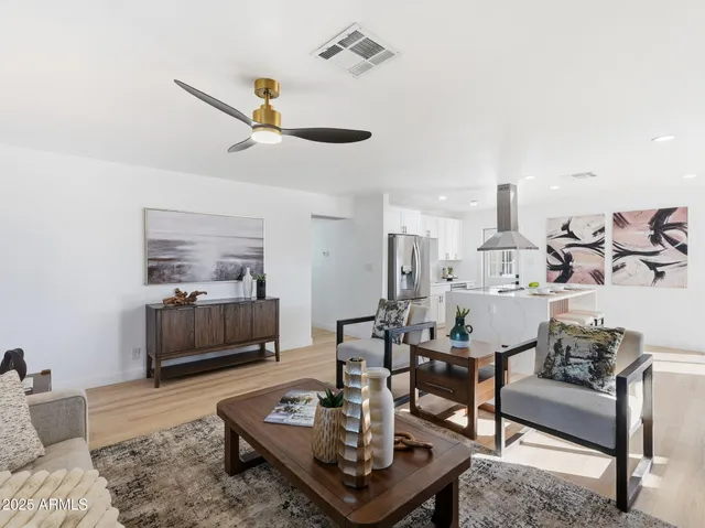 a kitchen with a table chairs stove and cabinets