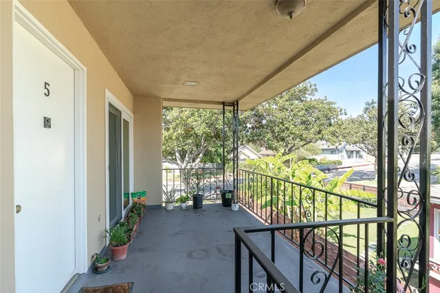 a view of an empty room and wooden floor