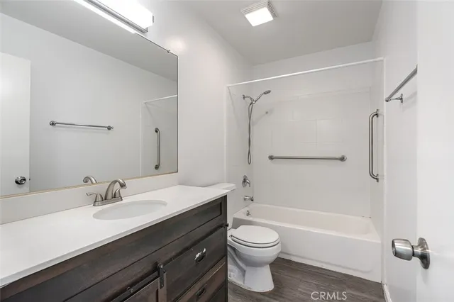 a kitchen with granite countertop a stove top oven and sink