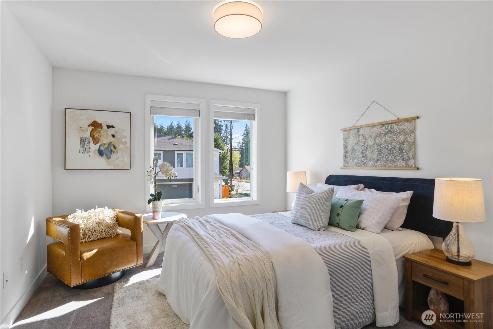 121 171st Place Southwest, Unit B Bothell, WA 98012 - Photo 28 of 36 a bedroom with a bed and wooden floor