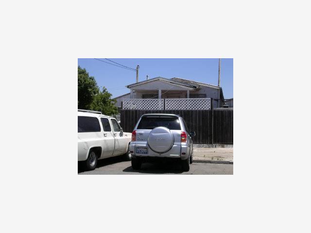 1226 Egbert Avenue San Francisco County, CA 94124 - Photo 1 of 1 a car parked in front of a house