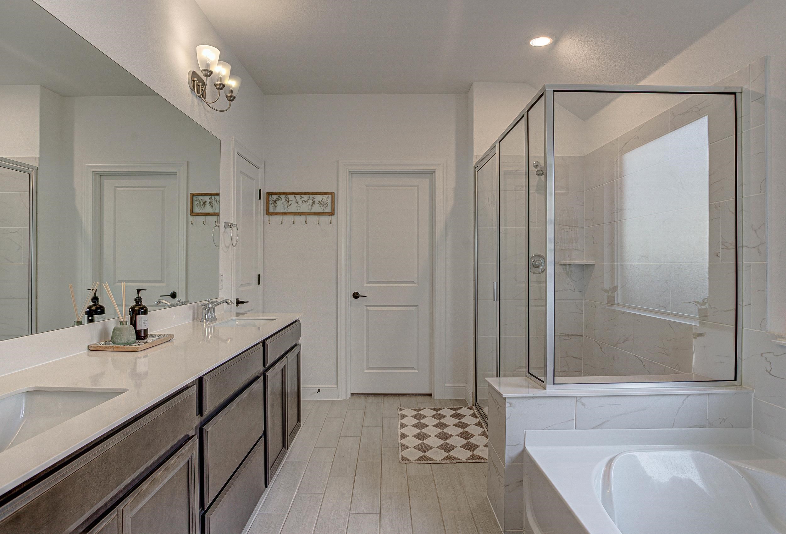 149 Slenderleaf Drive Marble Falls, TX 78654 - Photo 16 of 30 a bathroom with a sink a mirror and a shower