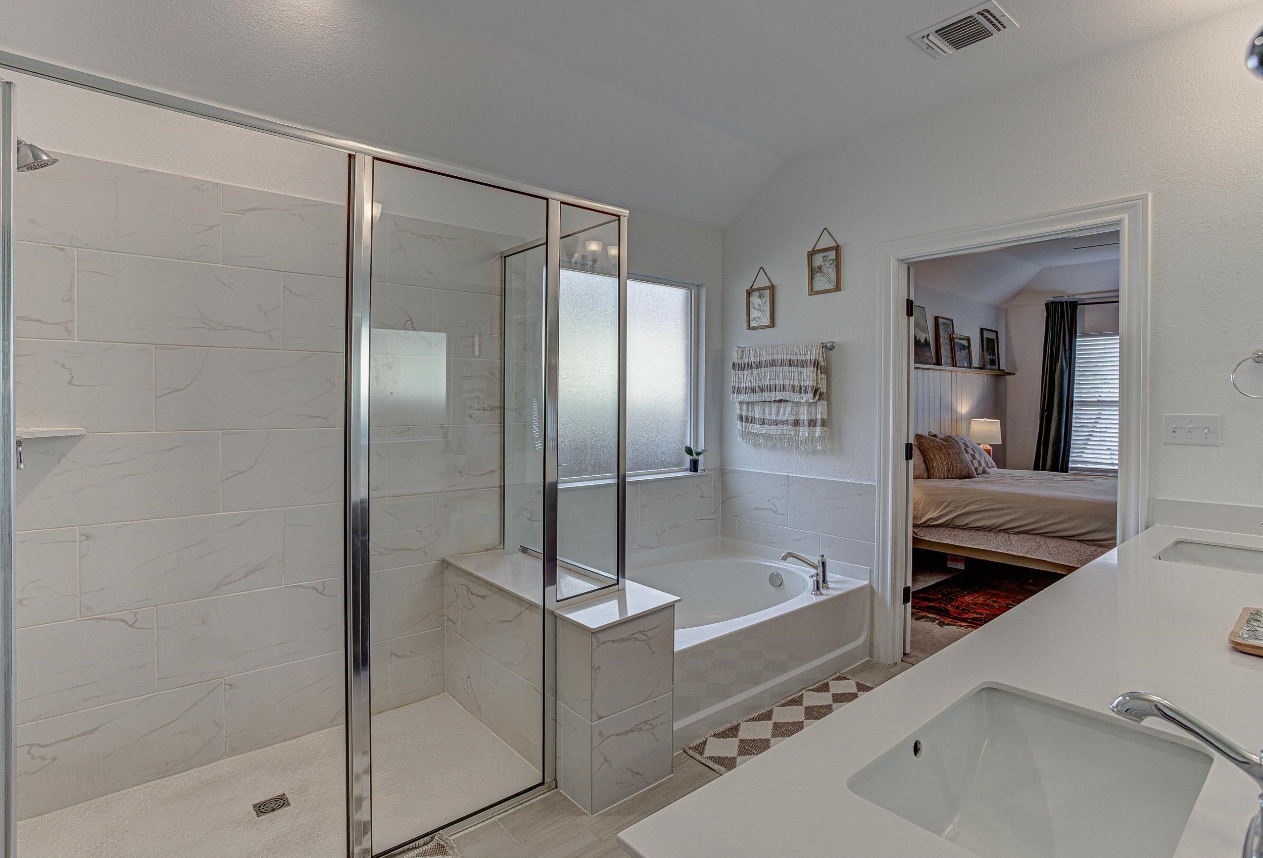 149 Slenderleaf Drive Marble Falls, TX 78654 - Photo 18 of 30 a bathroom with a tub and shower