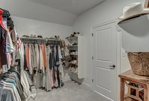 a bedroom with a bed and a table in it