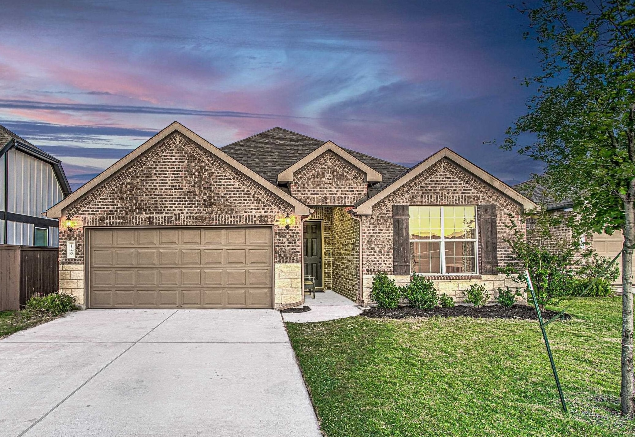 149 Slenderleaf Drive Marble Falls, TX 78654 - Photo 2 of 30 a front view of a house with garden