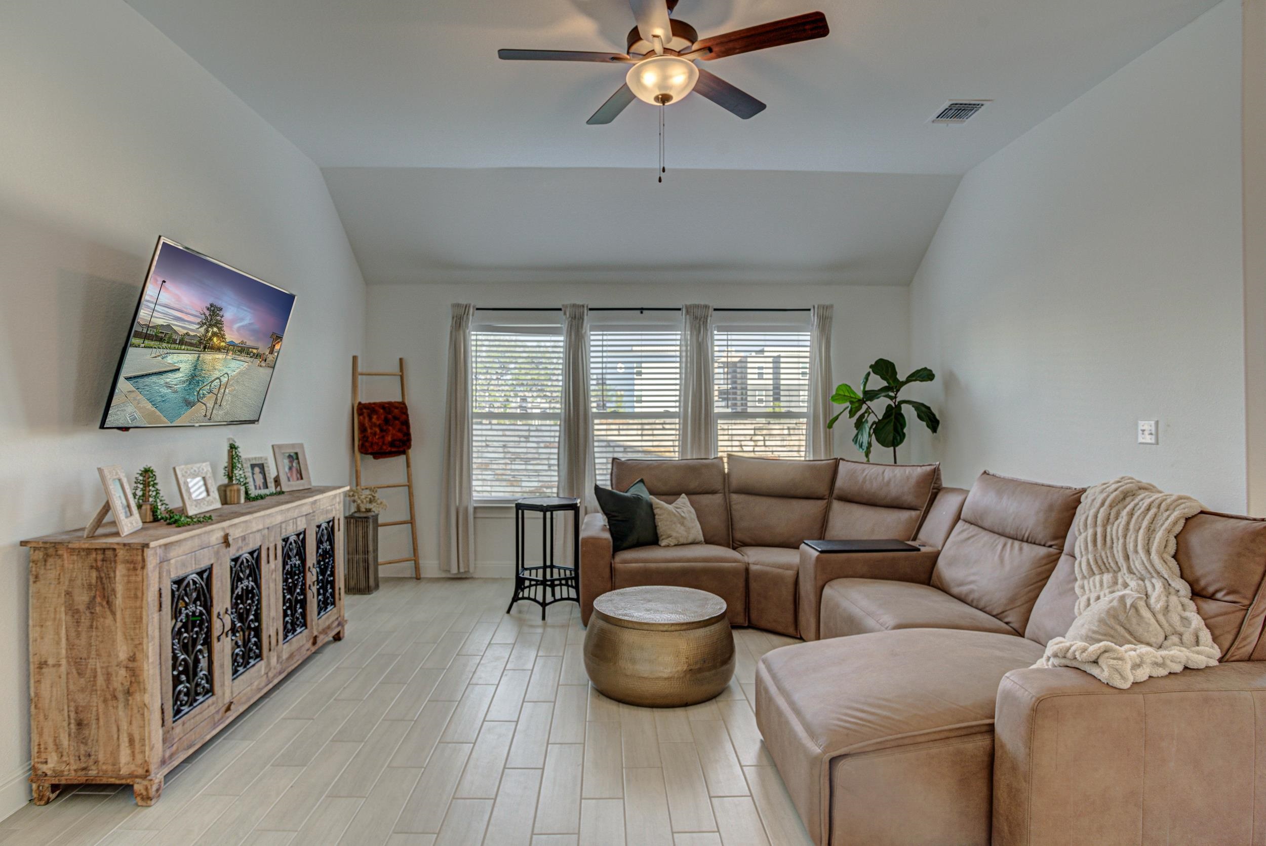 149 Slenderleaf Drive Marble Falls, TX 78654 - Photo 8 of 30 a living room with furniture and a flat screen tv