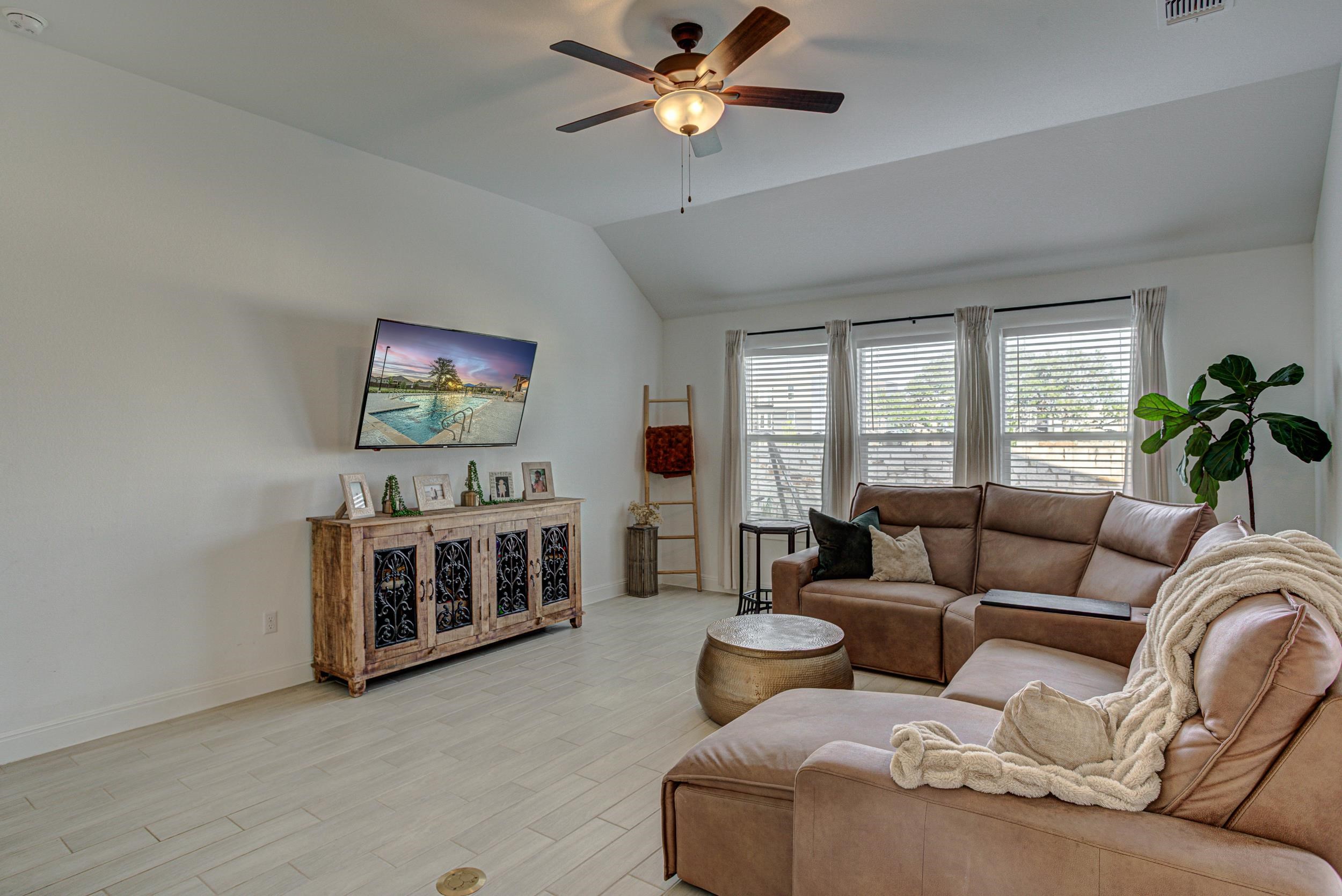 149 Slenderleaf Drive Marble Falls, TX 78654 - Photo 9 of 30 a living room with furniture and a flat screen tv