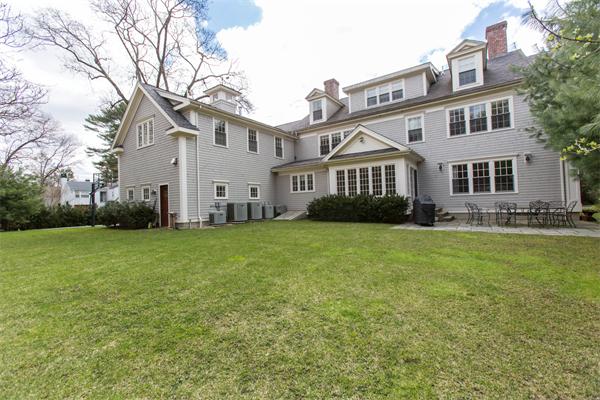 56 Windsor Road Wellesley, MA 02481 - Photo 21 of 24 a front view of a house with a garden