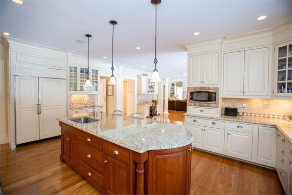 56 Windsor Road Wellesley, MA 02481 - Photo 9 of 24 a kitchen with stainless steel appliances granite countertop a sink a stove and a refrigerator
