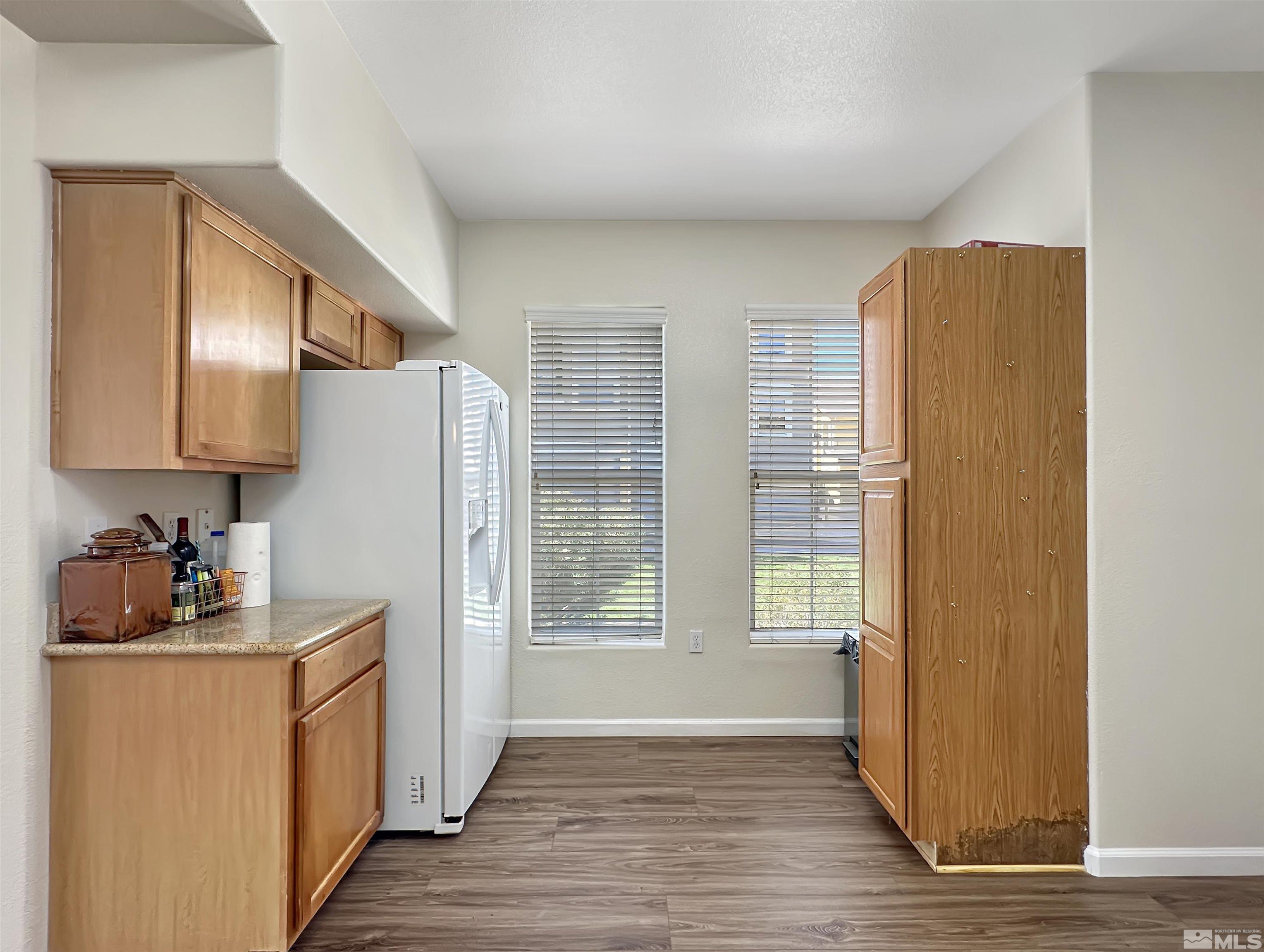 9050 Double R Boulevard, Unit 311 Reno, NV 89521 - Photo 13 of 37 a kitchen with stainless steel appliances a refrigerator and a stove