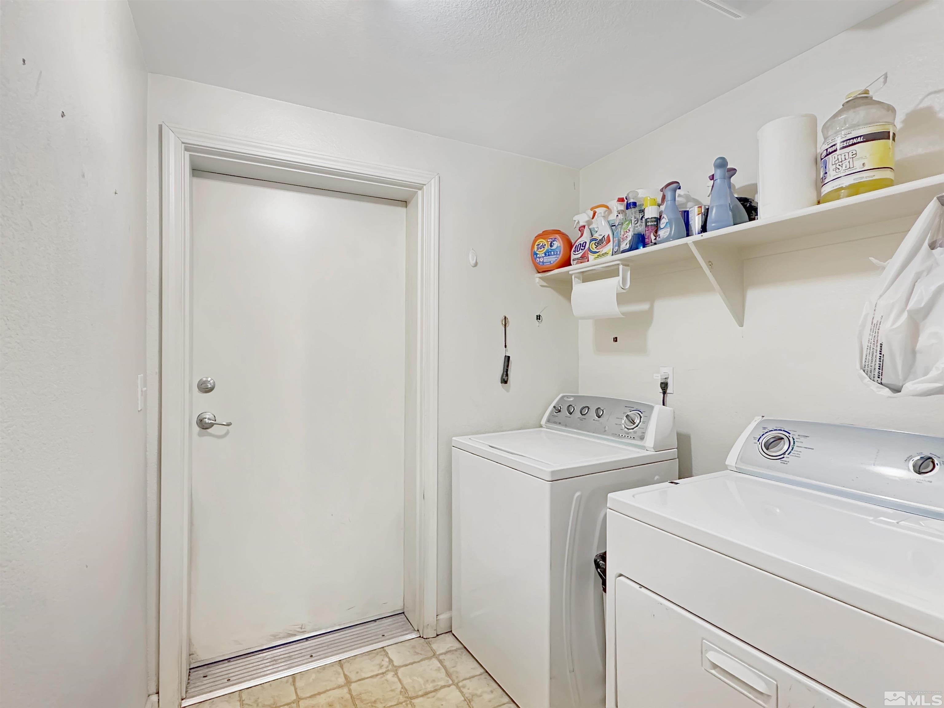 9050 Double R Boulevard, Unit 311 Reno, NV 89521 - Photo 23 of 37 a utility room with dryer and washer