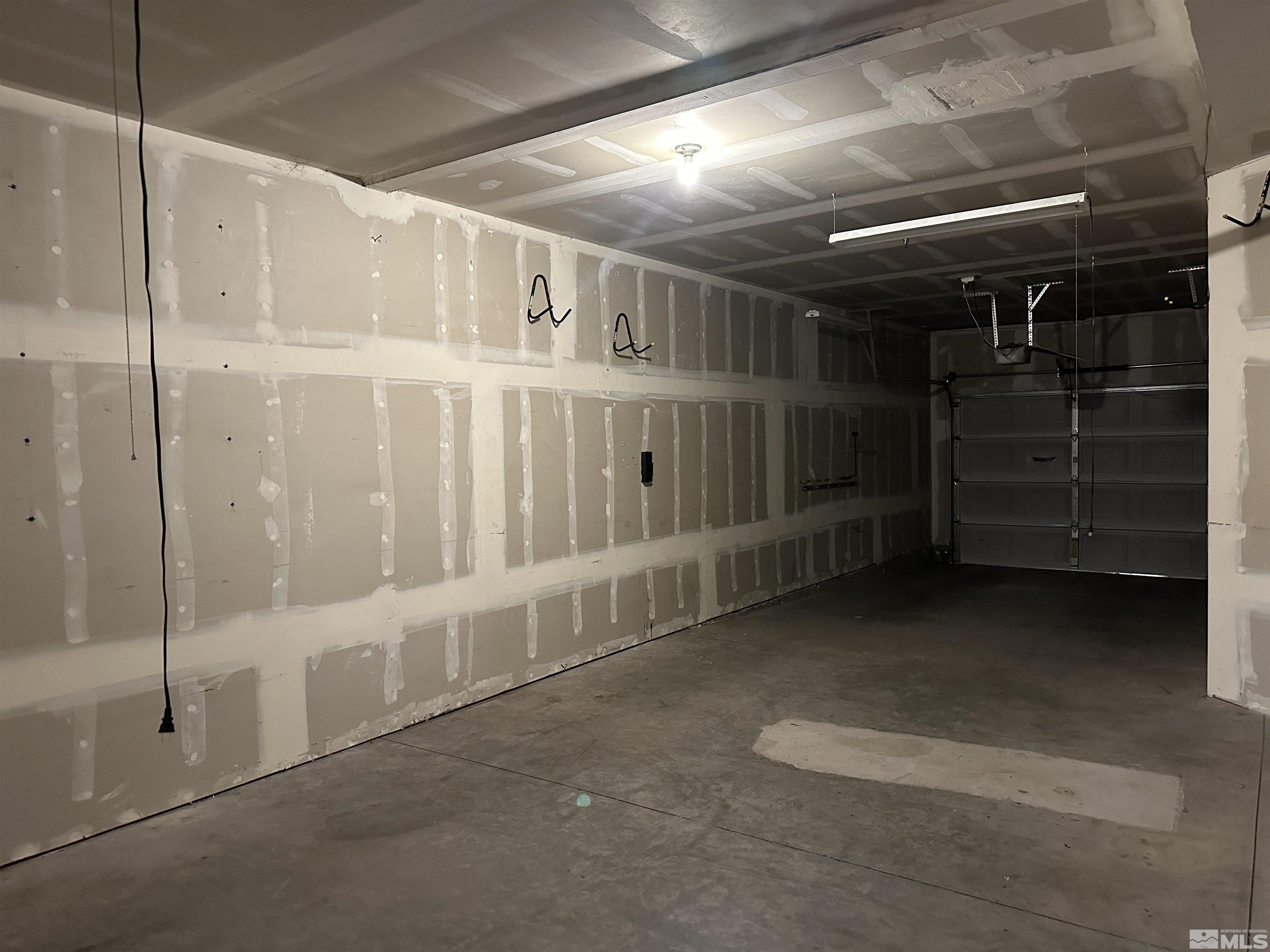 9050 Double R Boulevard, Unit 311 Reno, NV 89521 - Photo 24 of 37 a view of an empty room with a garage
