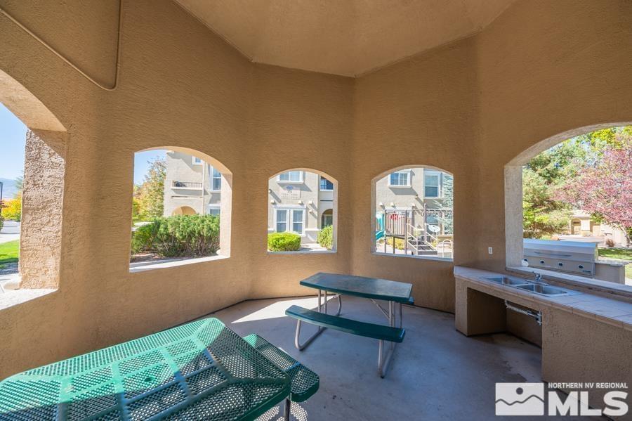 9050 Double R Boulevard, Unit 311 Reno, NV 89521 - Photo 31 of 37 a living room with furniture and a window