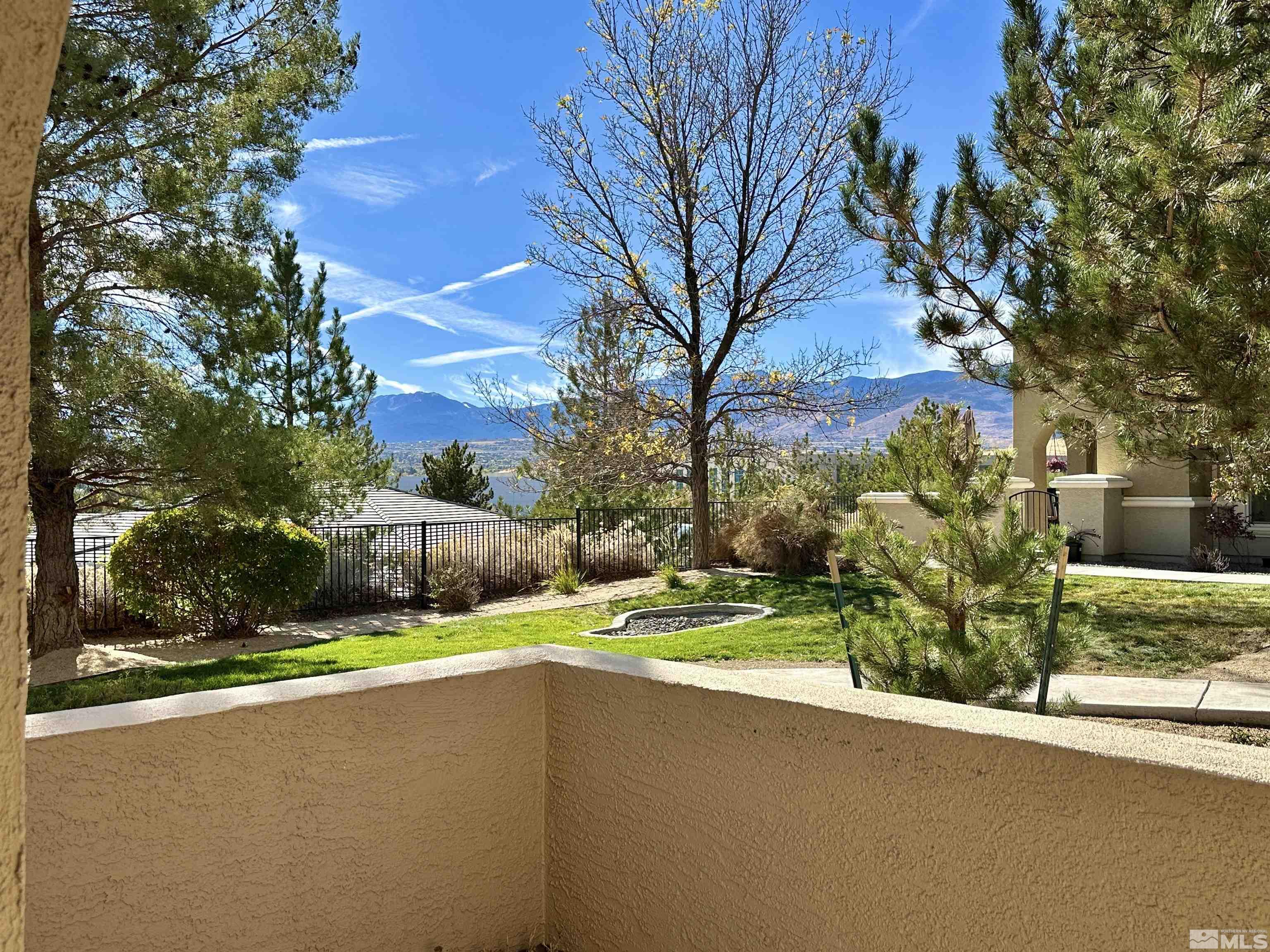 9050 Double R Boulevard, Unit 311 Reno, NV 89521 - Photo 4 of 37 a view of a house with a yard and tree s