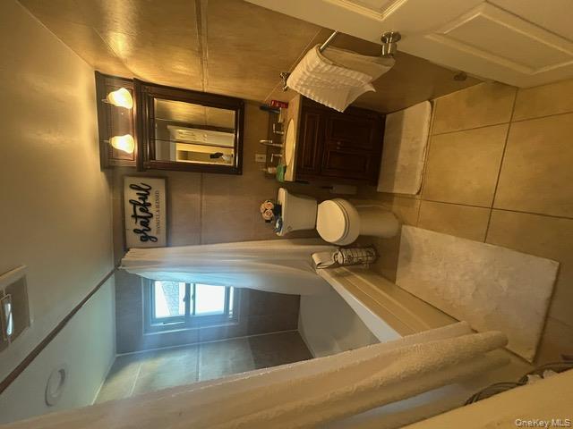 182 Wellington Road Elmont, NY 11003 - Photo 11 of 12 a bathroom with a sink toilet and shower