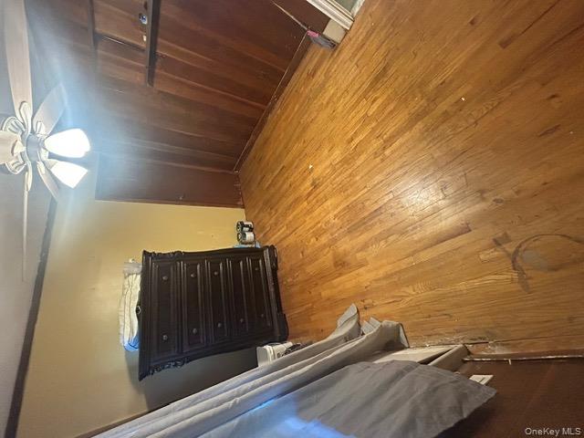 182 Wellington Road Elmont, NY 11003 - Photo 12 of 12 a view of an empty room with a chandelier fan