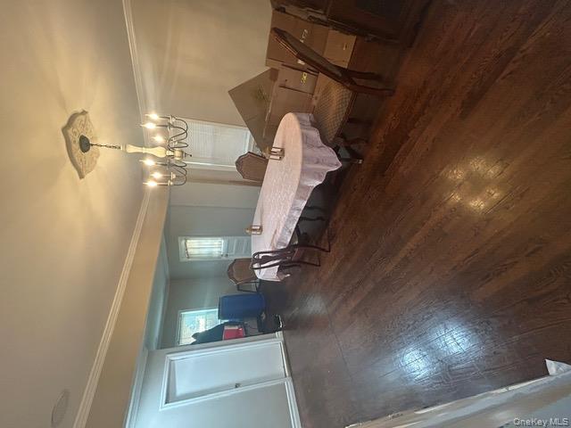 182 Wellington Road Elmont, NY 11003 - Photo 2 of 12 a dining room with furniture and chandelier