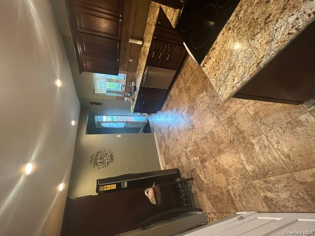 182 Wellington Road Elmont, NY 11003 - Photo 3 of 12 a living room with stainless steel appliances kitchen island granite countertop furniture and a refrigerator