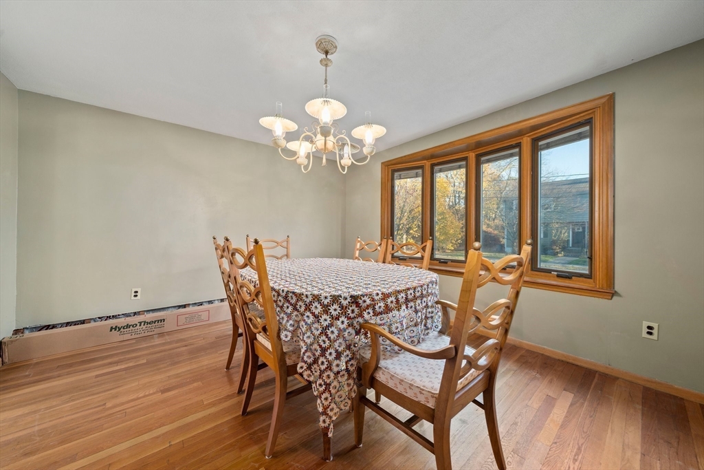 12 Prospect Park Boston, MA 02136 - Photo 16 of 42 a view of a dining room with furniture wooden floor and chandelier