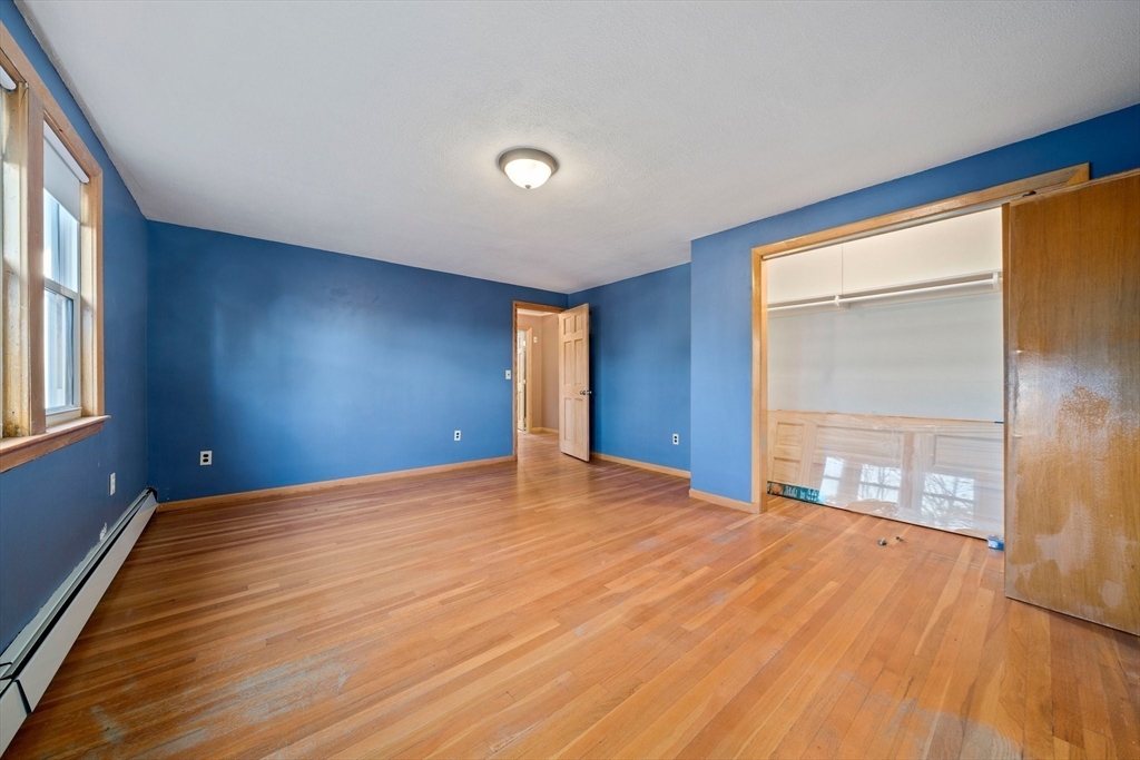 12 Prospect Park Boston, MA 02136 - Photo 20 of 42 a view of an empty room with wooden floor and a window