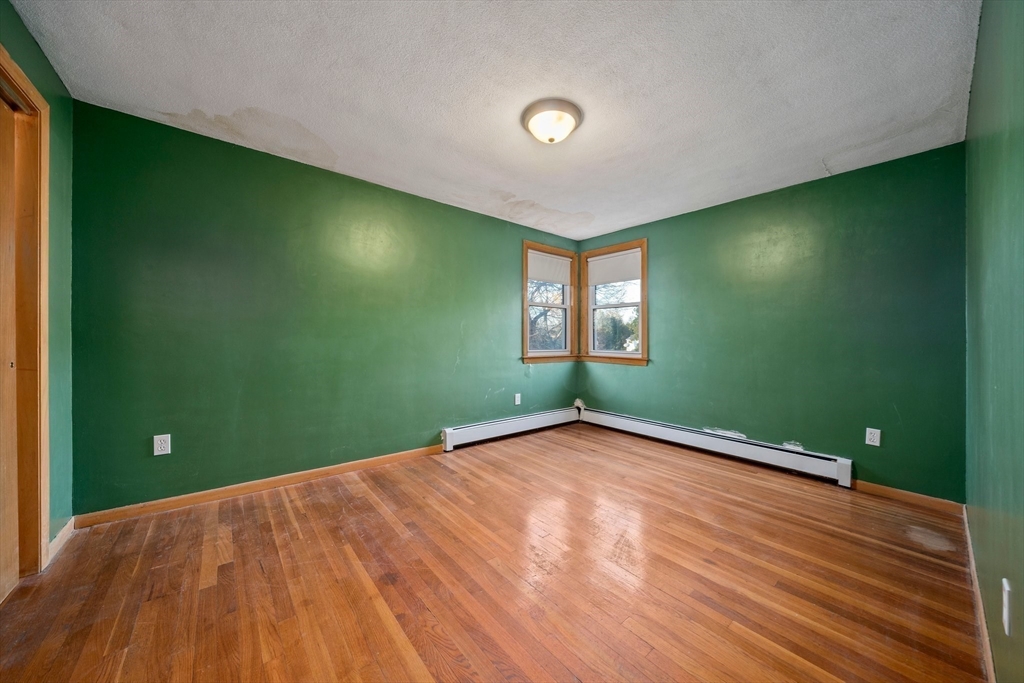 12 Prospect Park Boston, MA 02136 - Photo 21 of 42 a view of a livingroom with a plants and wooden floor