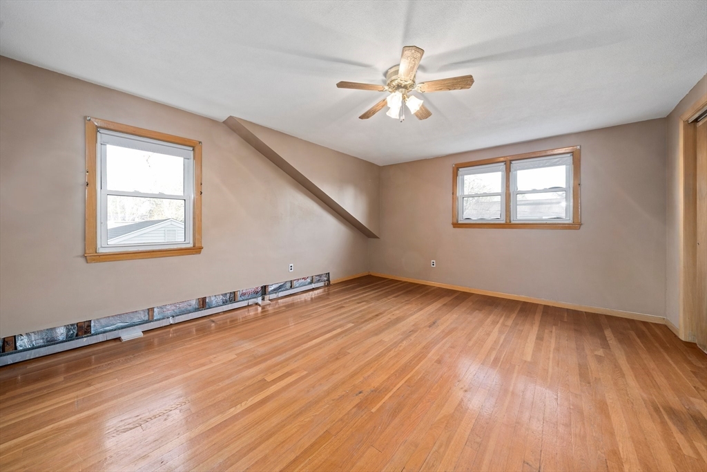12 Prospect Park Boston, MA 02136 - Photo 22 of 42 a view of an empty room with wooden floor and a window