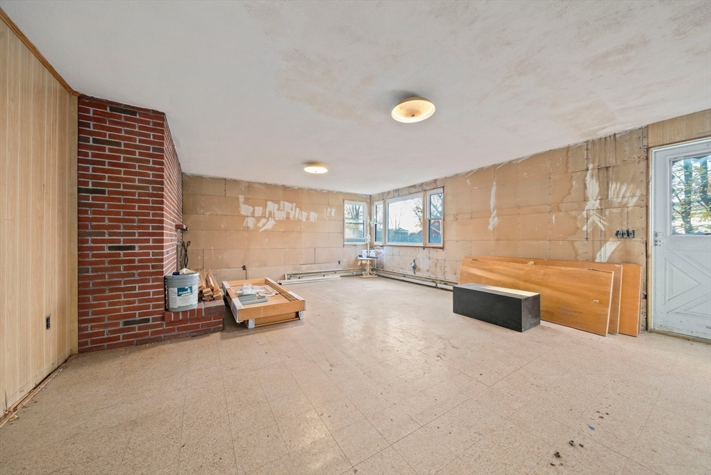 12 Prospect Park Boston, MA 02136 - Photo 24 of 42 a living room with furniture gym equipment and a large window
