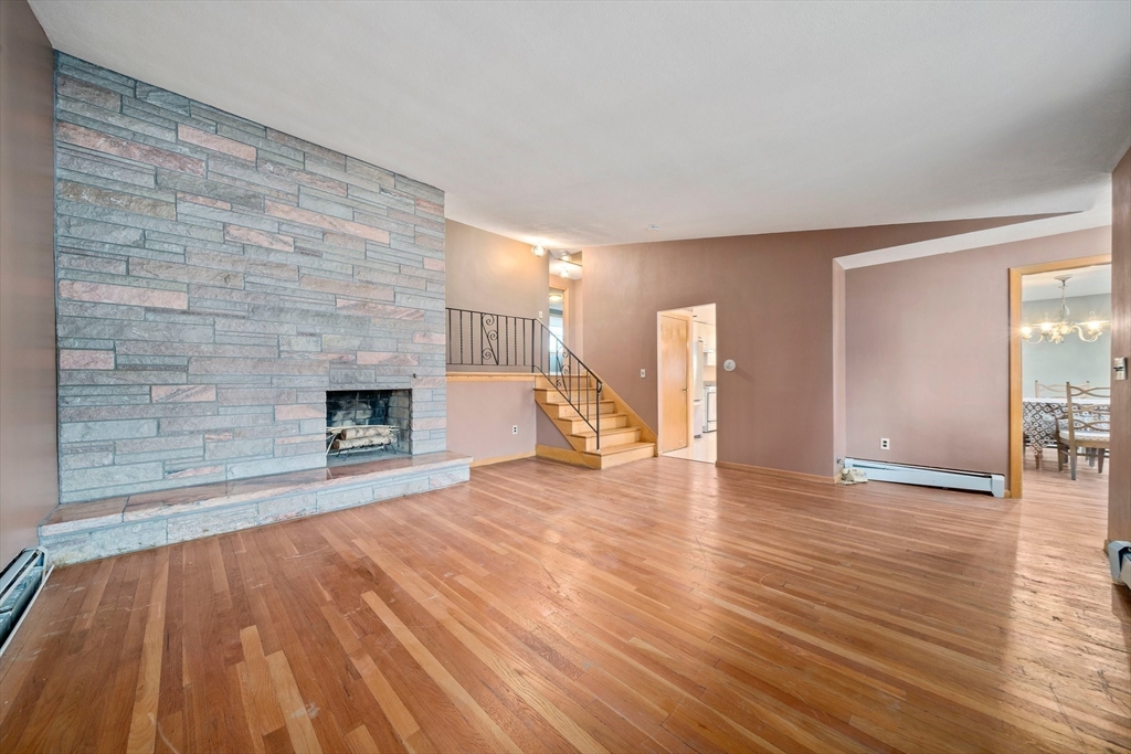 12 Prospect Park Boston, MA 02136 - Photo 8 of 42 a view of empty room with wooden floor and fireplace