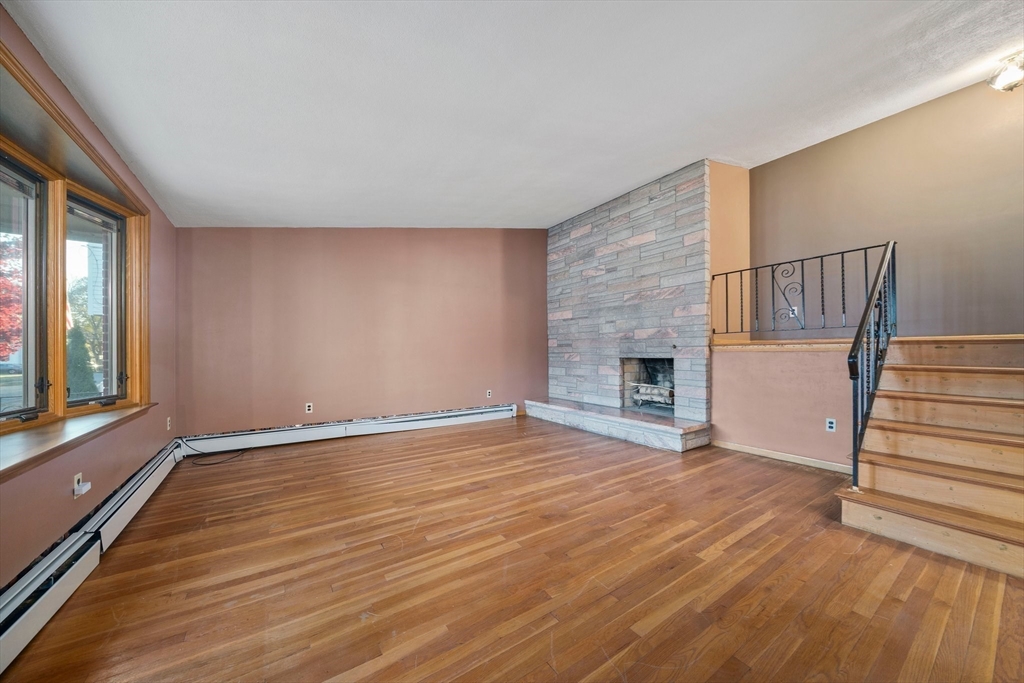 12 Prospect Park Boston, MA 02136 - Photo 9 of 42 a view of an empty room with wooden floor and a window