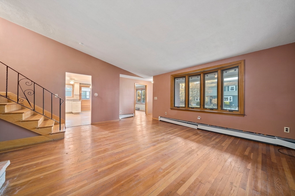 12 Prospect Park Boston, MA 02136 - Photo 10 of 42 a view of an empty room with wooden floor and a window