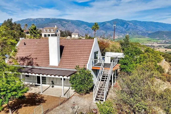 an aerial view of residential houses and outdoor space