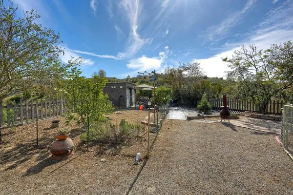a view of a backyard with sitting area