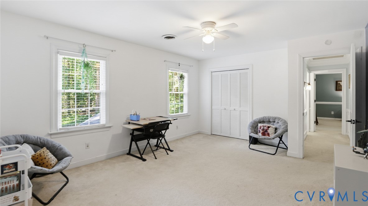 10716 Chalkley Road Richmond, VA 23237 - Photo 35 of 46 a living room with furniture and a window