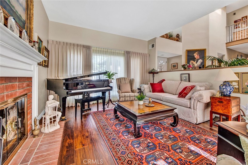 7214 East Wrangler Circle Orange, CA 92869 - Photo 12 of 69 a living room with furniture and a wooden floor
