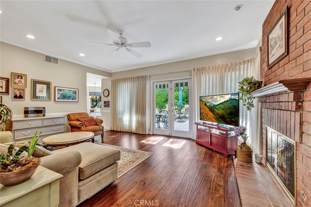 7214 East Wrangler Circle Orange, CA 92869 - Photo 16 of 69 a living room with furniture and a flat screen tv