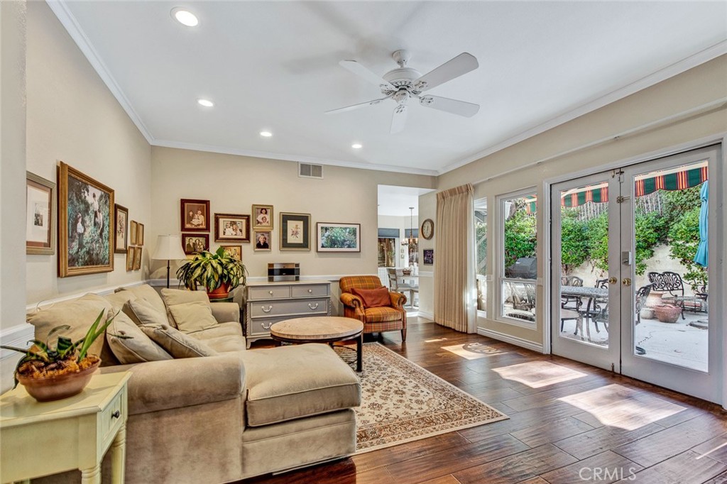 7214 East Wrangler Circle Orange, CA 92869 - Photo 18 of 69 a living room with furniture and floor to ceiling windows