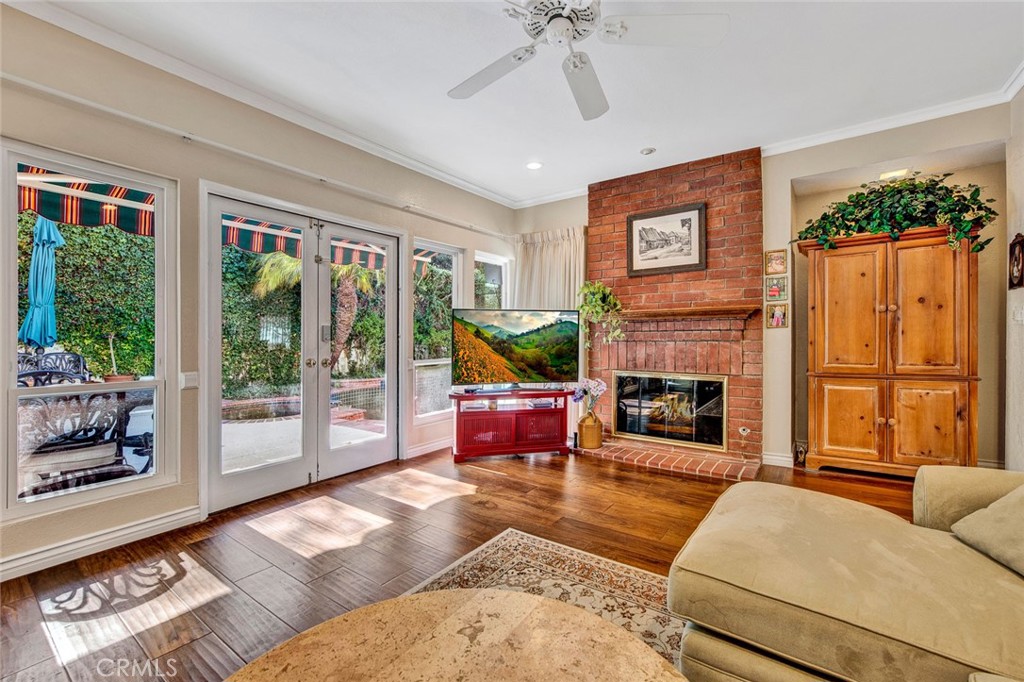 7214 East Wrangler Circle Orange, CA 92869 - Photo 20 of 69 a living room with furniture large window and fireplace