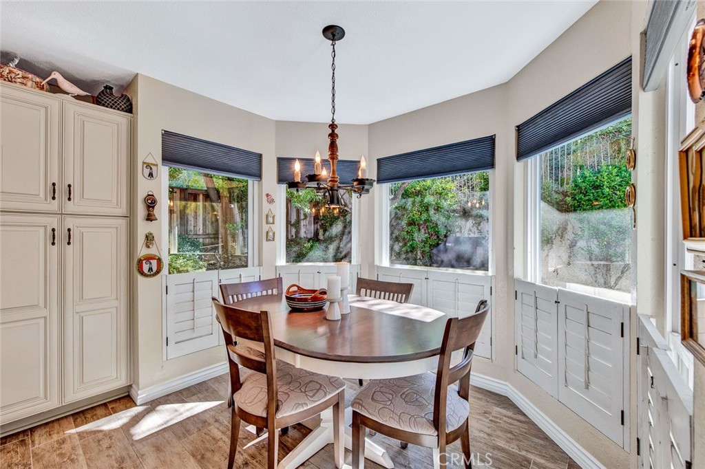 7214 East Wrangler Circle Orange, CA 92869 - Photo 22 of 69 a dining room with furniture window wooden floor