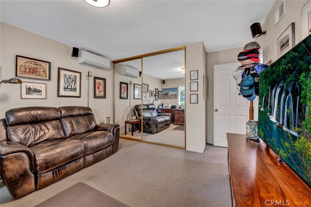 7214 East Wrangler Circle Orange, CA 92869 - Photo 45 of 69 a living room with furniture and a potted plant