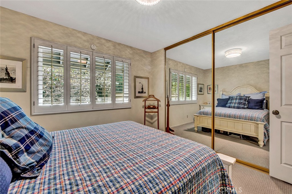 7214 East Wrangler Circle Orange, CA 92869 - Photo 48 of 69 a bedroom with a large bed and a window