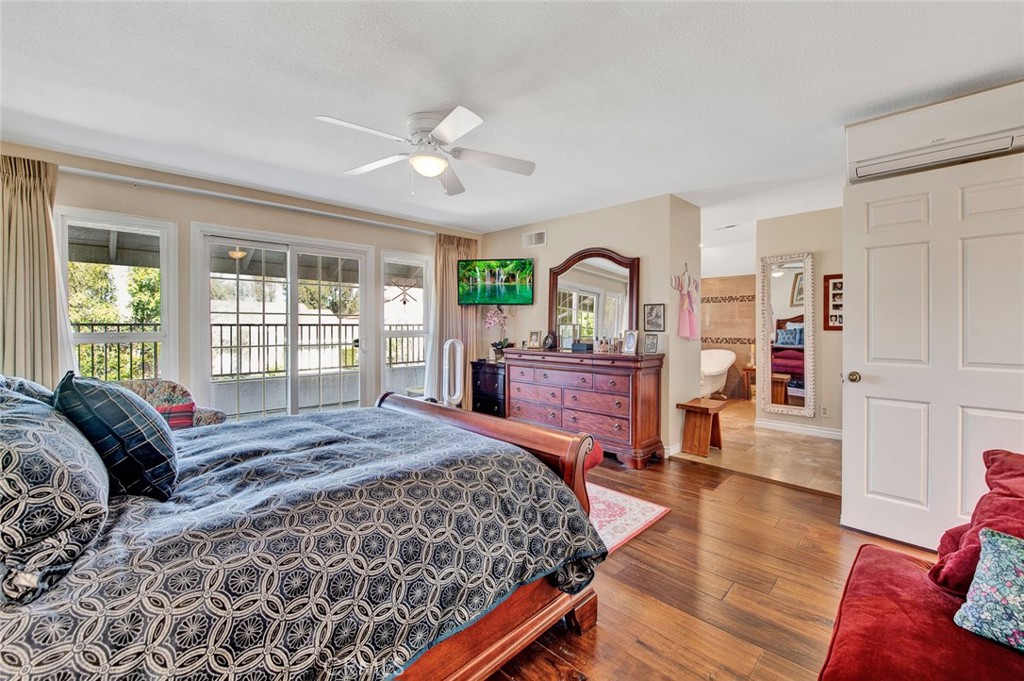 7214 East Wrangler Circle Orange, CA 92869 - Photo 51 of 69 a bed room with a bed and a large window