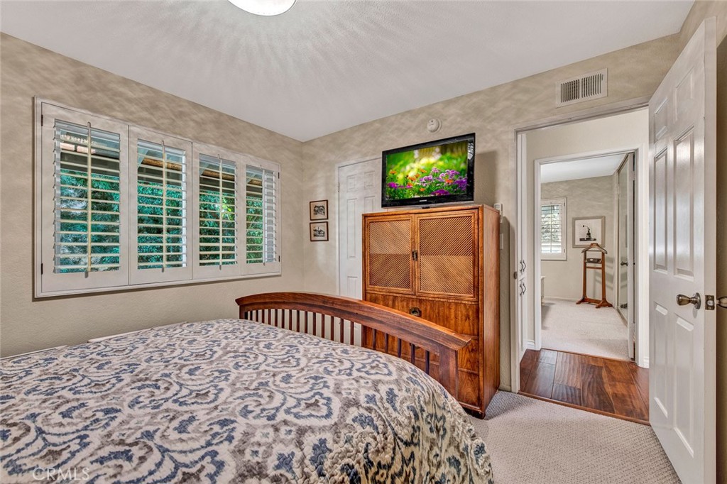 7214 East Wrangler Circle Orange, CA 92869 - Photo 52 of 69 a bedroom with a bed and a large window