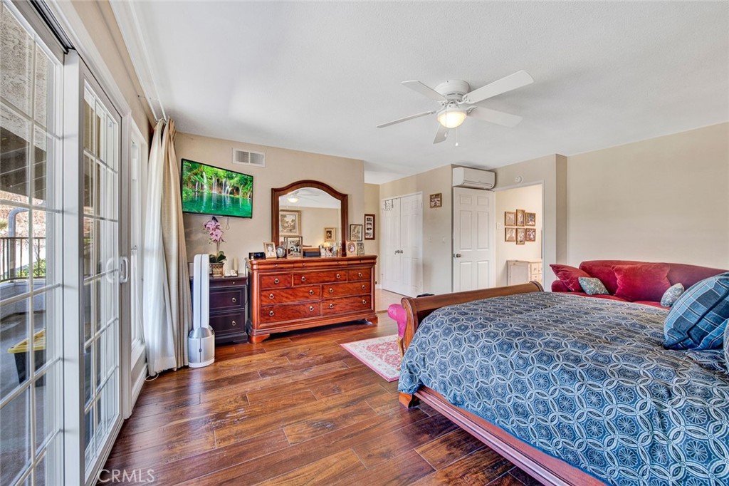 7214 East Wrangler Circle Orange, CA 92869 - Photo 53 of 69 a bedroom with a bed and a dresser