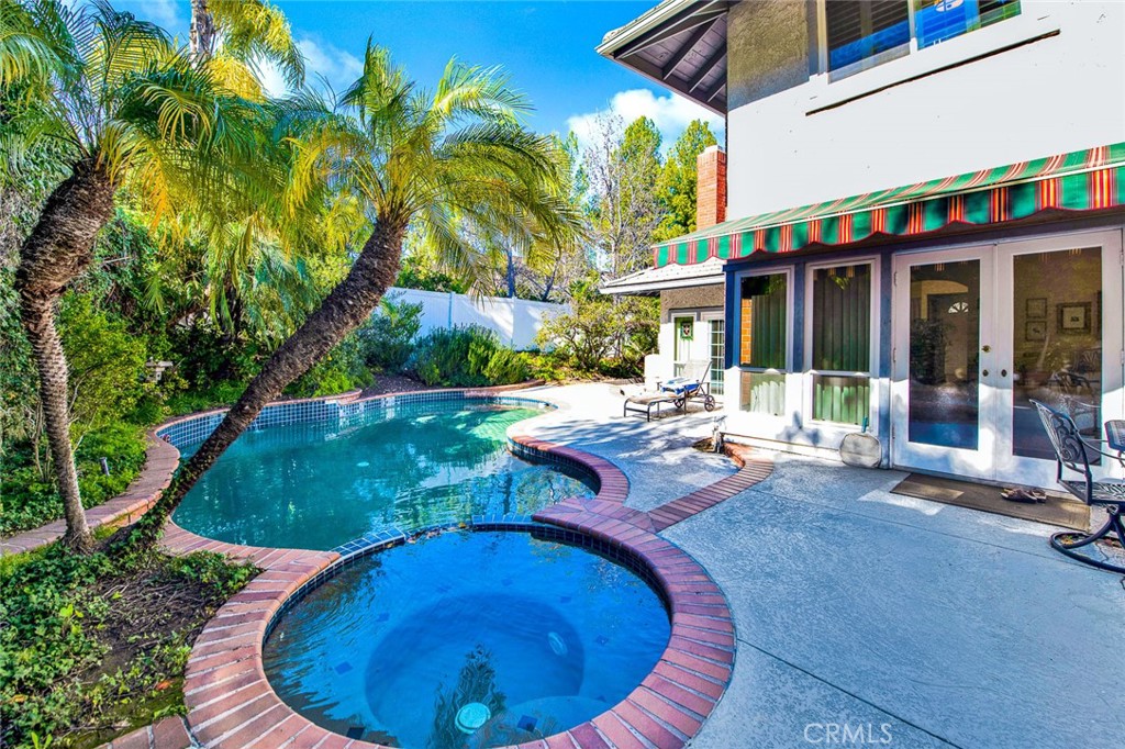 7214 East Wrangler Circle Orange, CA 92869 - Photo 62 of 69 a view of a backyard with plants and a patio