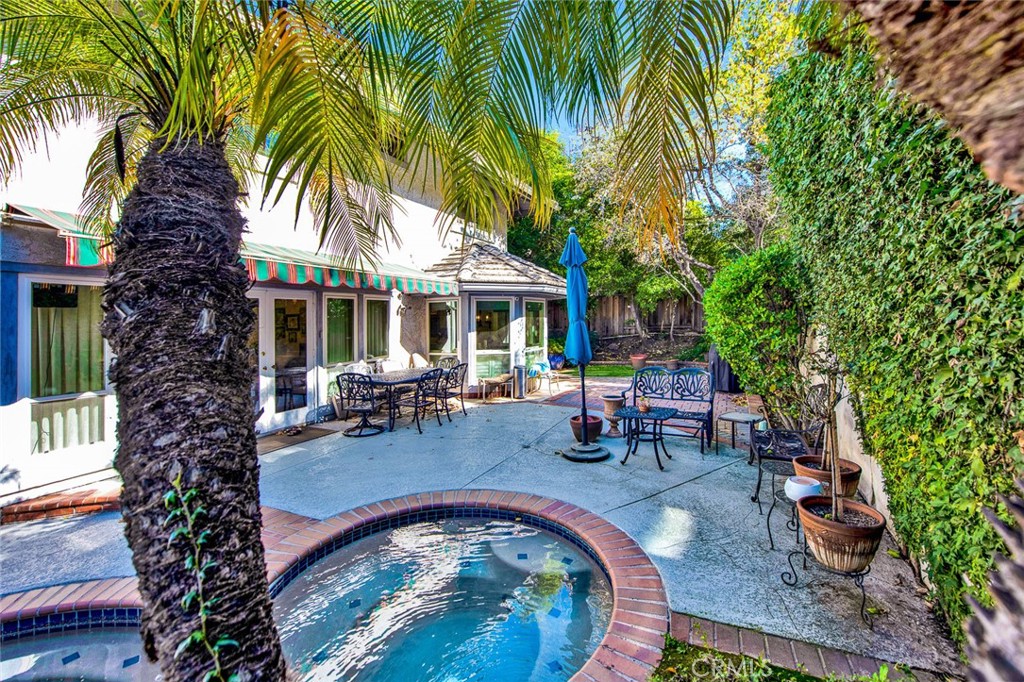 7214 East Wrangler Circle Orange, CA 92869 - Photo 67 of 69 a view of a house with swimming pool and sitting area