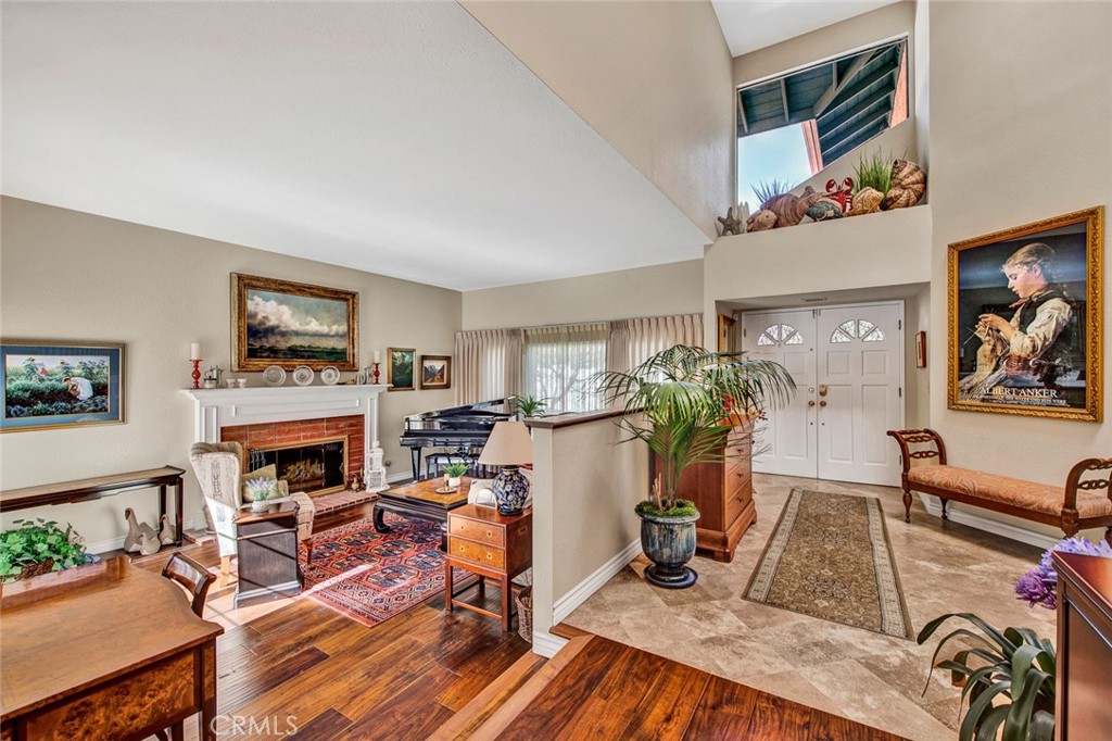 7214 East Wrangler Circle Orange, CA 92869 - Photo 10 of 69 a living room with furniture flat screen tv and a fireplace