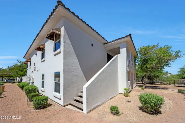 a view of a house with a street